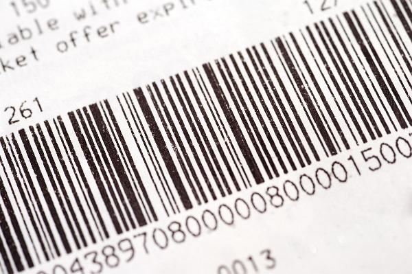 Barcode on a stock item or inventory identifying the description and price by means of bars representing numbers that can be read by a laser scanner