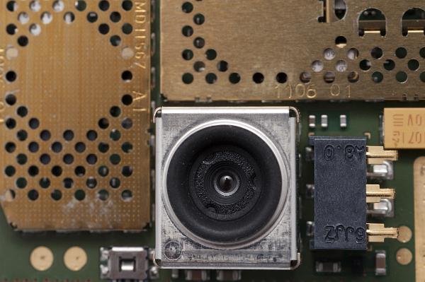 a tiny camera from inside a mobile phone, these cameras use piezo materials to focus their lenses or are fixed focus
