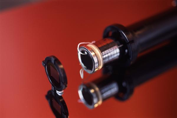 Vidicon camera tube in which incident light forms an electric charge pattern on a photoconductive surface. for subsequent electron-beam scanning