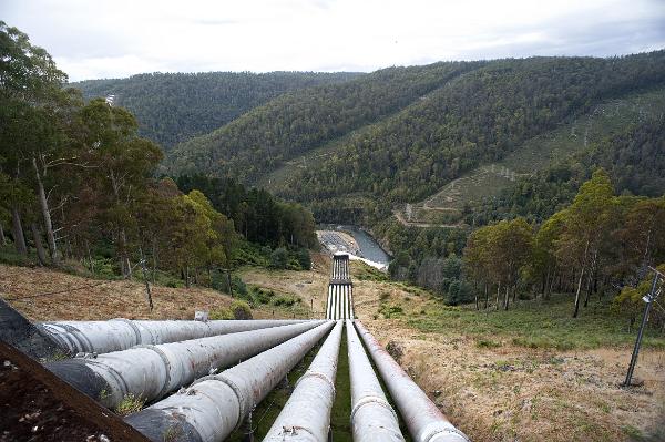 Water pipes at a hydroelectric scheme transporting water to the turbines to generate electricity, renewable or alternative energy concept