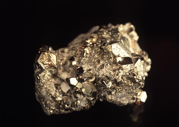 Specimen of golden metalllic iron pyrites or Fools Gold, composed of iron sulfide used as iron ore and in the production of sulphuric acid and sulphur dioxide