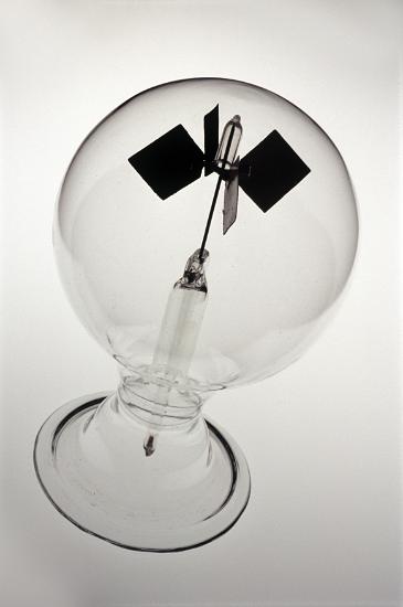 Crookes radiometer or light mill is an airtight globe with a partial vacuum, light falling on the blades of the willdmill in the centre causes them to rotate