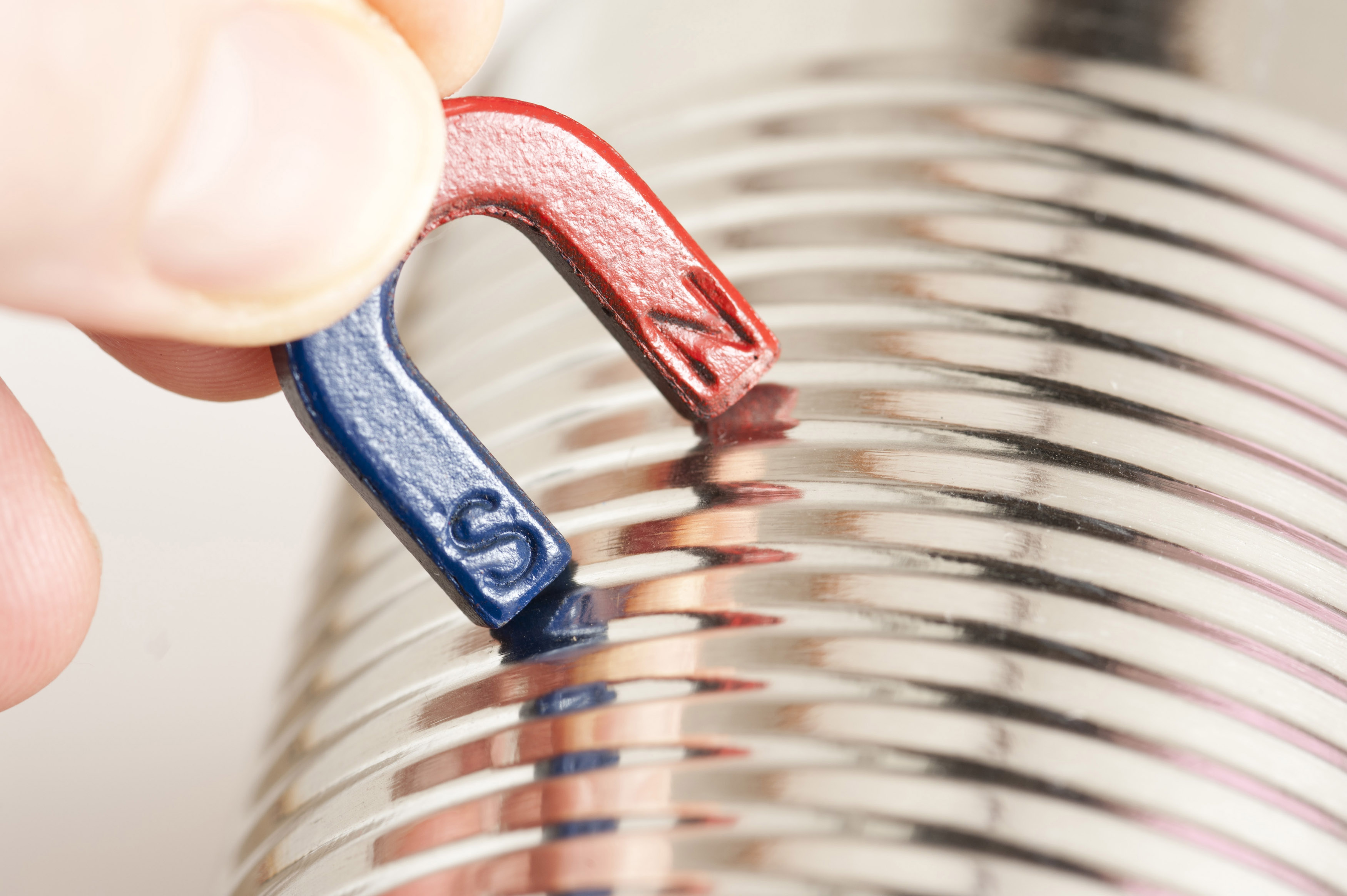 Free Stock image of Small horseshoe testing a steel can