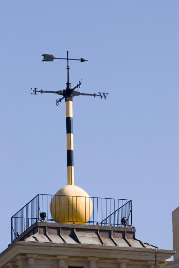 Observatory time ball and weather vane on top of a building, an obsolete time signalling device that was used by mariners to verify marine chronometers when the ball dropped at a specific time