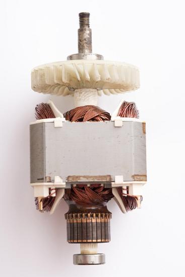 Universal AC motor with cover removed Universal AC motor with cover removed to reveal the wiring and commutator over a white background
