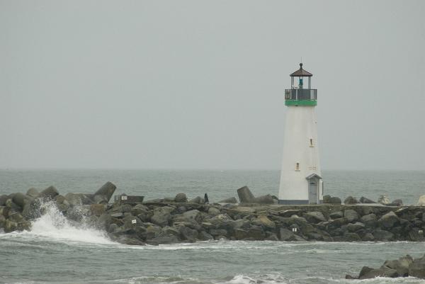 santa cruz marina Santa cruz harbour navigation lighhouse on a stormy day, different coloured navigations lights are used to aid ships navigating in the dark